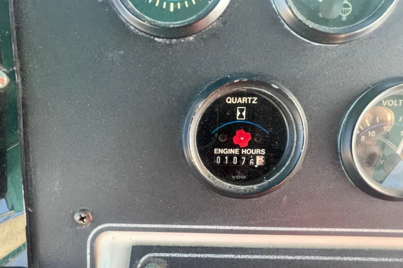 Slide: The Image of Engine hour meter on 1995 Carver 355 Aft Cabin Motor Yacht, showing 1076 hours. - 12