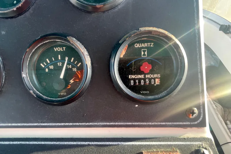 Slide: The Image of Close-up of 1995 Carver 355 Aft Cabin Motor Yacht gauges showing voltage and engine hours. - 13