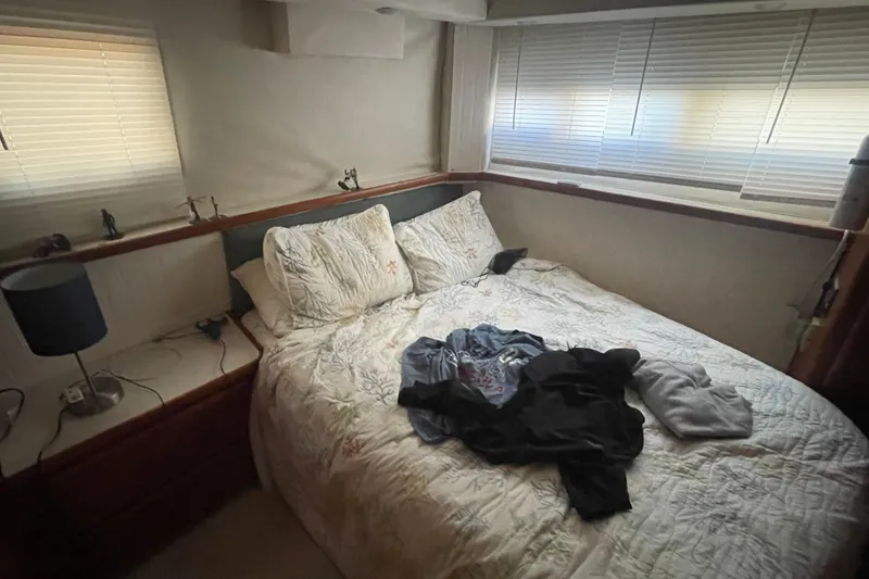 Slide: The Image of Cozy bedroom in 1995 Carver 355 Aft Cabin Motor Yacht with bed and lamp. - 29