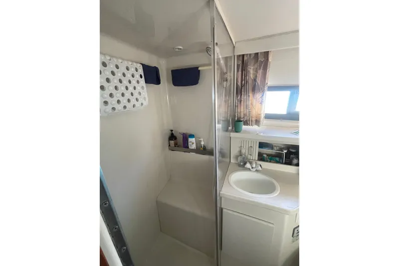 Slide: The Image of 1995 Carver 355 Aft Cabin Motor Yacht bathroom with shower and sink. - 31