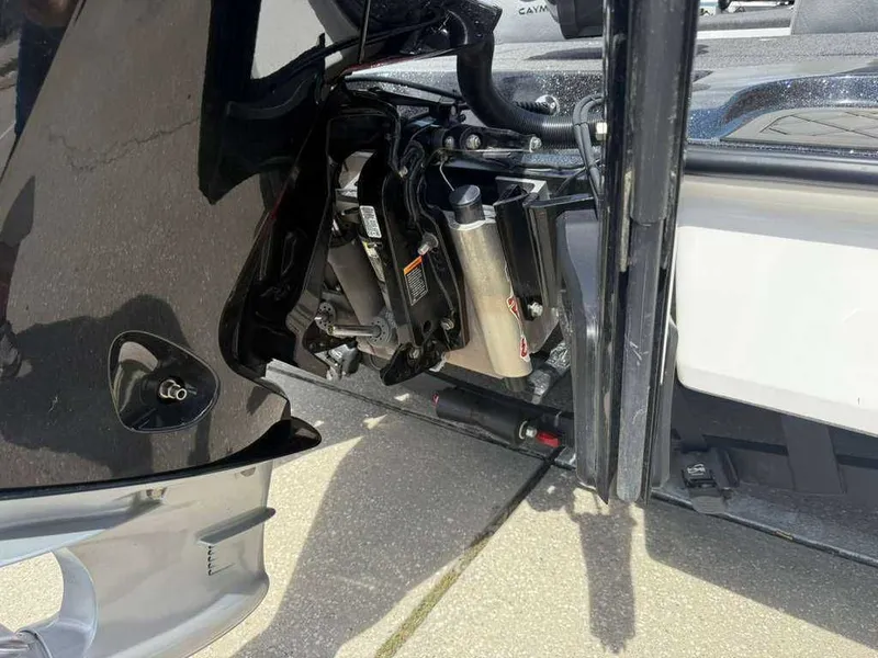 Slide: The Image of Close-up of a 2025 Caymas Bass CX 20 Pro engine. - 13