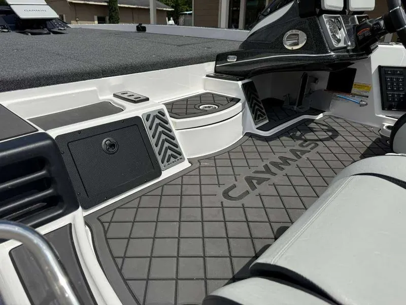 Slide: The Image of Interior of 2025 Caymas Bass CX 20 Pro with gray flooring. - 20