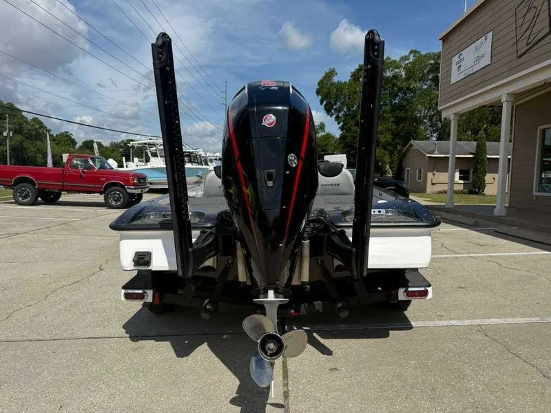 Slide: The Image of Rear view of a 2025 Caymas Bass CX 20 Pro boat in a parking lot. - 8