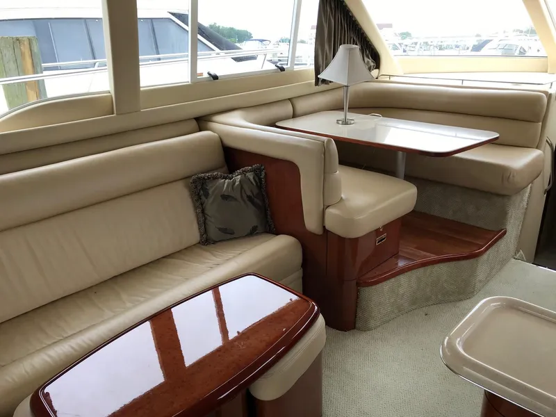 Slide: The Image of Interior of 2003 Sea Ray 480 Sedan Bridge with leather chairs. - 15