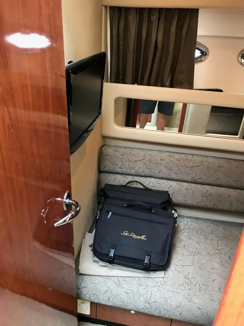 Slide: The Image of Luxurious bedroom in a 2003 Sea Ray 480 Sedan Bridge yacht. - 17