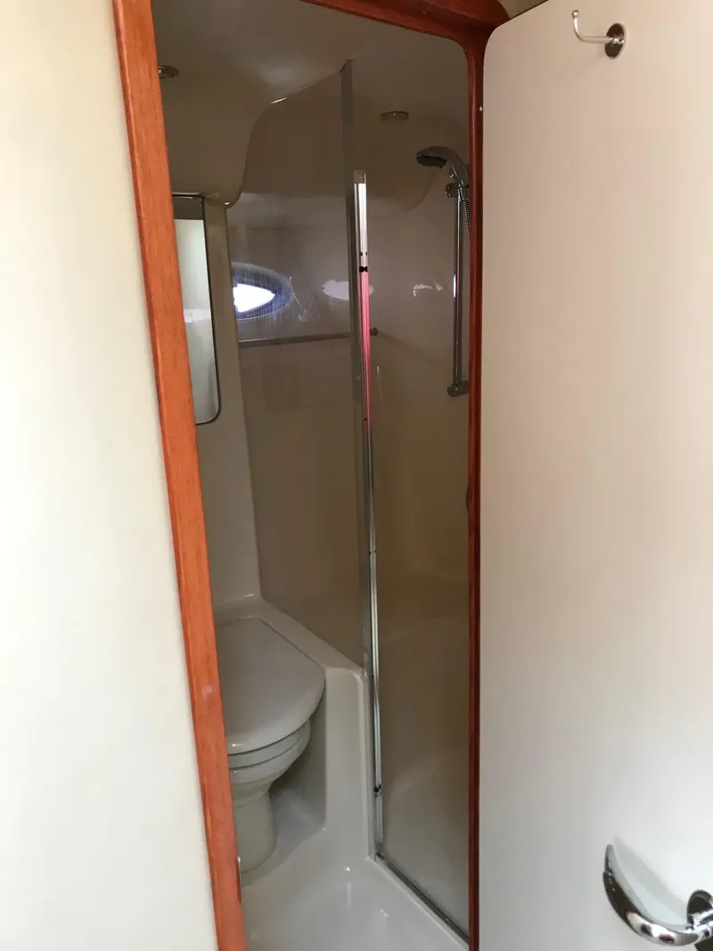 Slide: The Image of Interior view of 2003 Sea Ray 480 Sedan Bridge bathroom. - 21