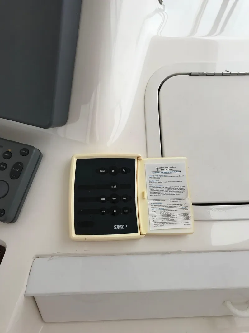 Slide: The Image of 2003 Sea Ray 480 Sedan Bridge navigation system with GPS display and controls. - 5