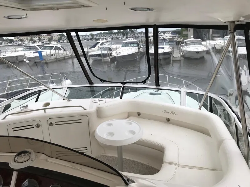 Slide: The Image of Interior of a 2003 Sea Ray 480 Sedan Bridge yacht at the marina. - 8