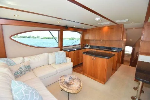 Slide: The Image of 2013 Hatteras GT54 yacht bathroom with shower and granite countertop. - 13