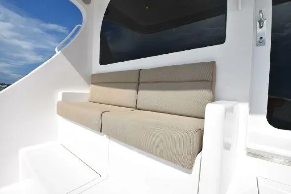 Slide: The Image of 2013 Hatteras GT54 yacht bathroom with modern fixtures and wooden cabinetry. - 14