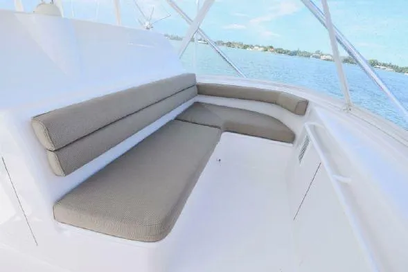 Slide: The Image of 2013 Hatteras GT54 yacht interior with spacious seating and ocean view. - 18