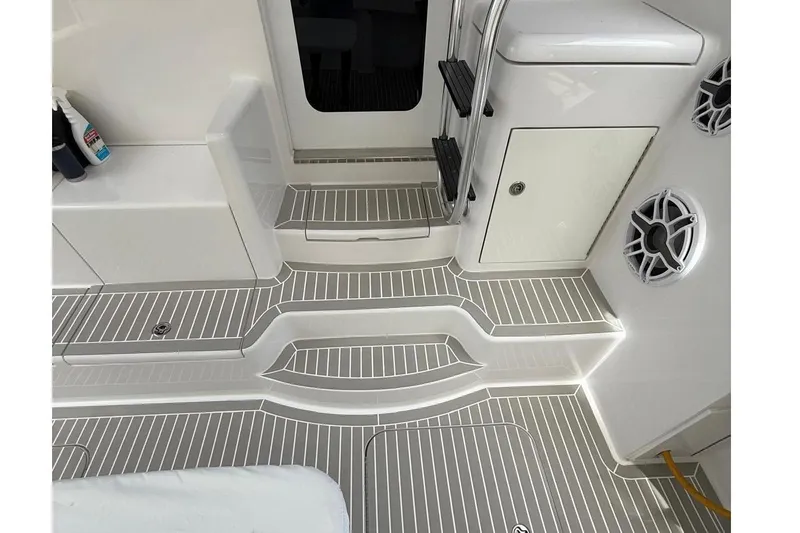 Slide: The Image of 2013 Hatteras GT54 yacht interior with sleek, modern design and striped flooring. - 25