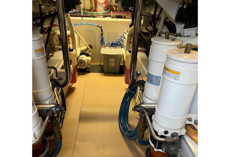 Slide: The Image of 2013 Hatteras GT54 boat deck with canopy, featuring sleek design and spacious layout. - 27