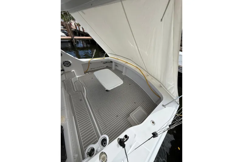 Slide: The Image of Engine room of 2013 Hatteras GT54 yacht, showcasing dual engines and mechanical components. - 29