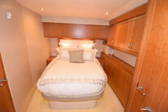 Slide: The Image of Luxurious interior of 2013 Hatteras GT54 yacht with plush seating and elegant decor. - 3