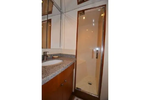 Slide: The Image of Luxurious interior of 2013 Hatteras GT54 yacht with elegant wood finishes and comfortable seating. - 4