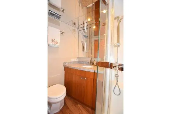 Slide: The Image of Interior of 2013 Hatteras GT54 yacht with dining area and TV. - 6