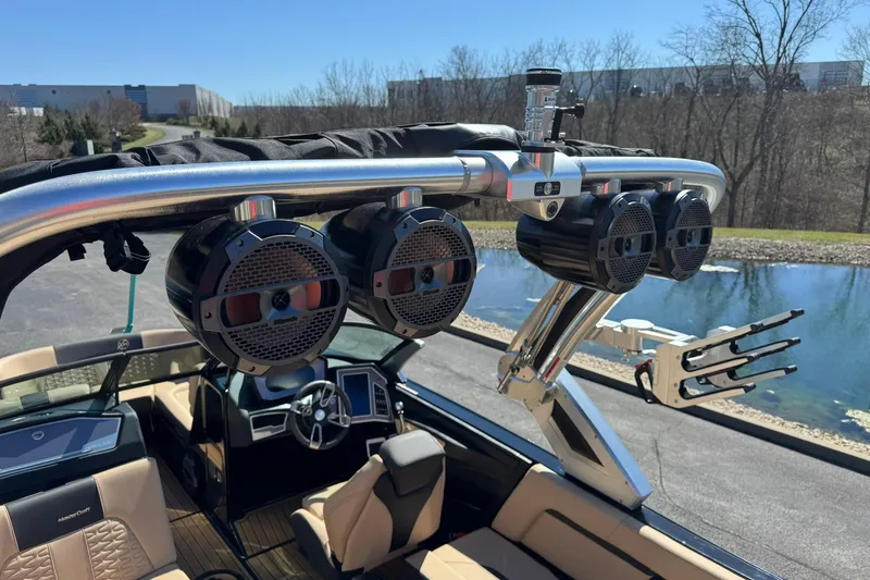 Slide: The Image of 2022 MasterCraft X24 boat with premium speakers and sleek interior design. - 13