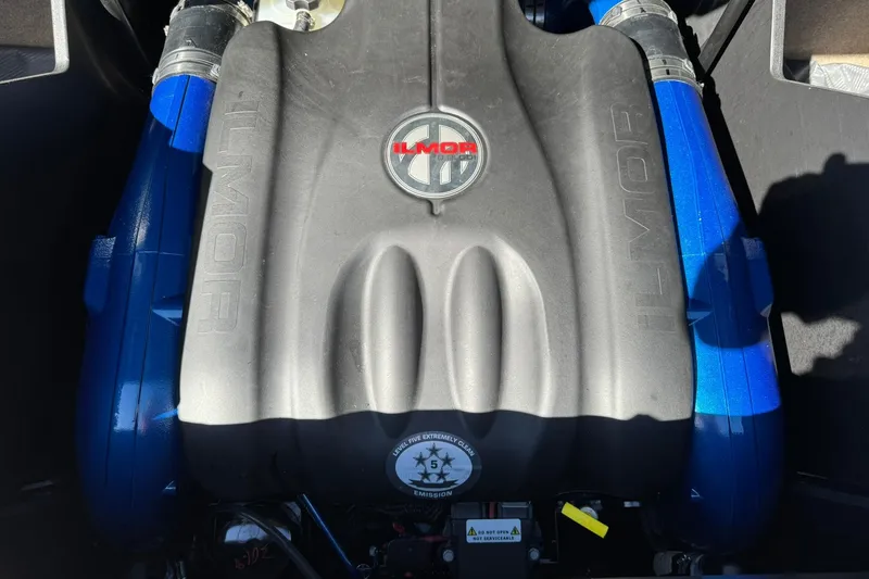 Slide: The Image of 2022 MasterCraft X24 Ilmor engine with blue accents, showcasing powerful performance. - 14