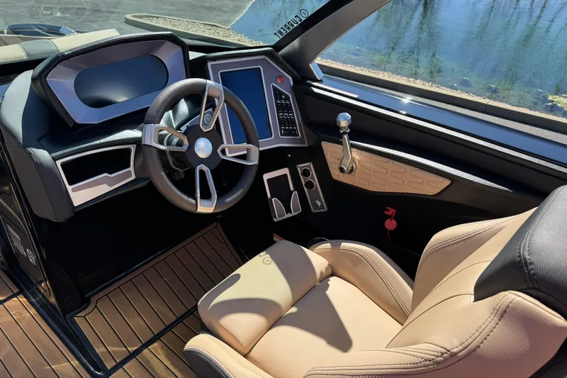 Slide: The Image of 2022 MasterCraft X24 boat cockpit with modern steering and control panel. - 9