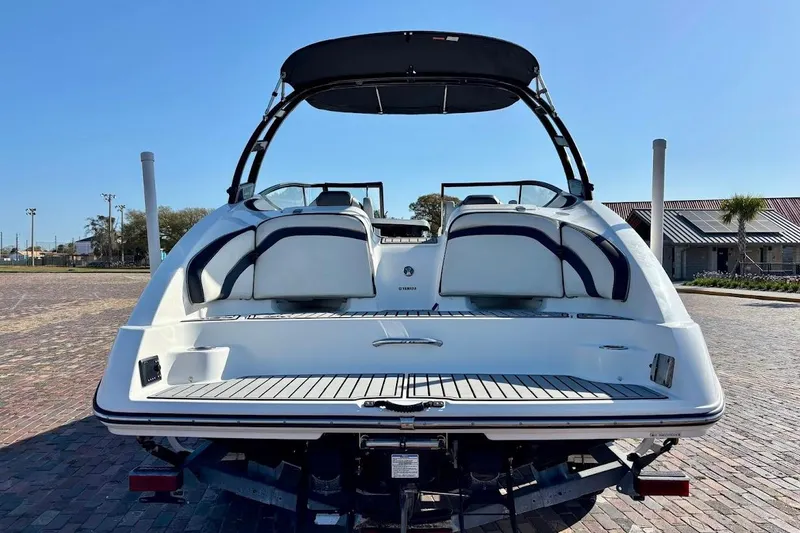 Slide: The Image of 2016 Yamaha Boats AR240 HO, rear view, on trailer, sunny day. - 10