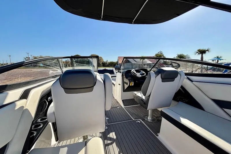 Slide: The Image of 2016 Yamaha Boats AR240 HO interior with sleek seating and modern dashboard. - 19