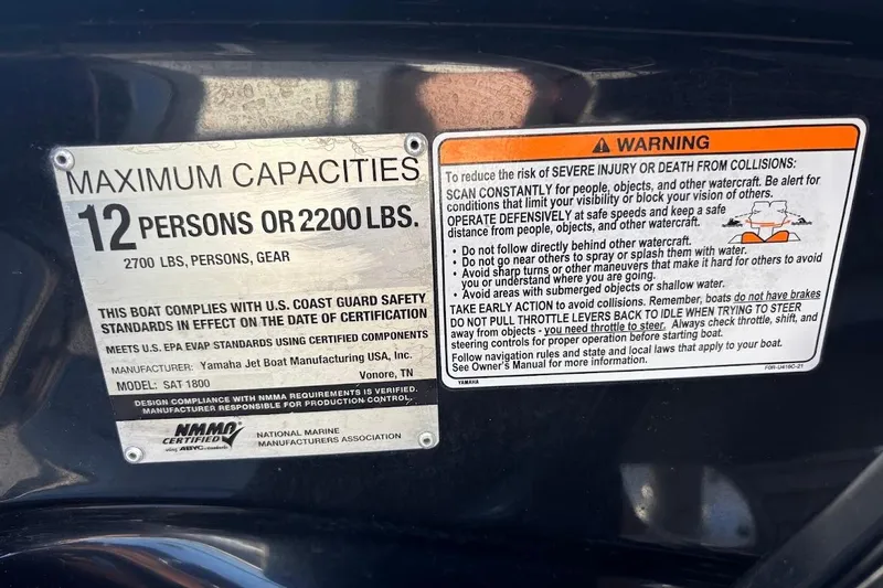 Slide: The Image of 2016 Yamaha Boats AR240 HO capacity and safety warning labels, maximum 12 persons or 2200 lbs. - 30