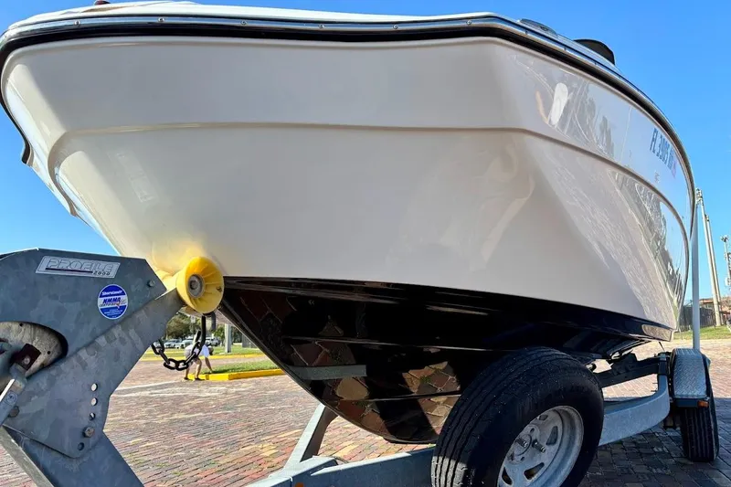 Slide: The Image of 2016 Yamaha Boats AR240 HO on trailer, close-up view of hull and trailer. - 8