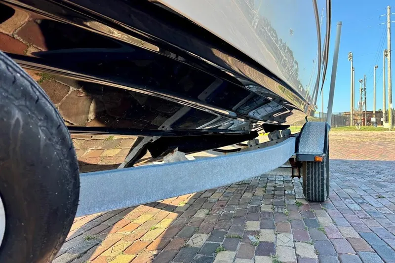 Slide: The Image of 2016 Yamaha Boats AR240 HO on trailer, showing hull and wheel detail. - 9