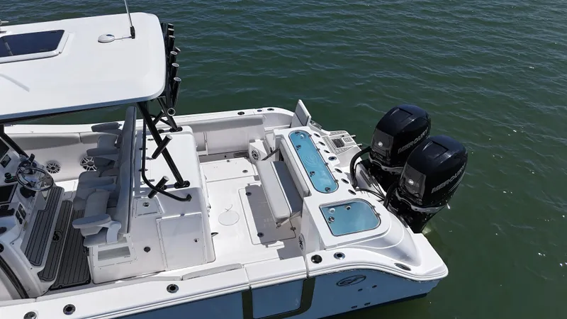 Slide: The Image of 2022 Sea Fox 328 Commander boat with dual outboard engines on the water. - 10
