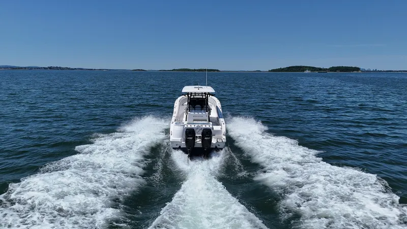 Slide: The Image of 2022 Sea Fox 328 Commander cruising on open water, rear view. - 12