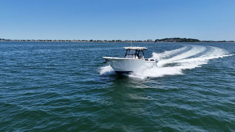 Slide: The Image of 2022 Sea Fox 328 Commander cruising on open water under clear blue skies. - 14
