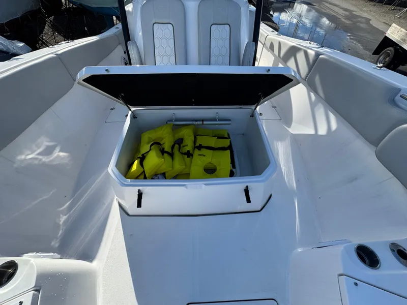 Slide: The Image of 2022 Sea Fox 328 Commander boat with open storage compartment holding yellow life jackets. - 29