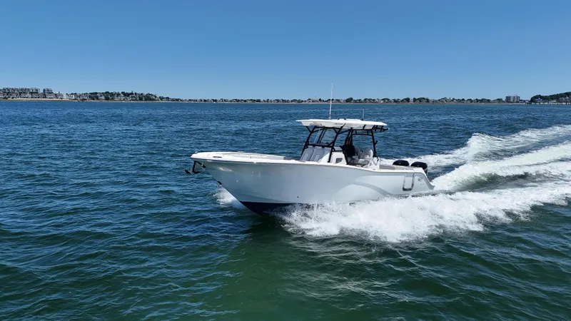 Slide: The Image of 2022 Sea Fox 328 Commander cruising on open water under clear blue skies. - 3