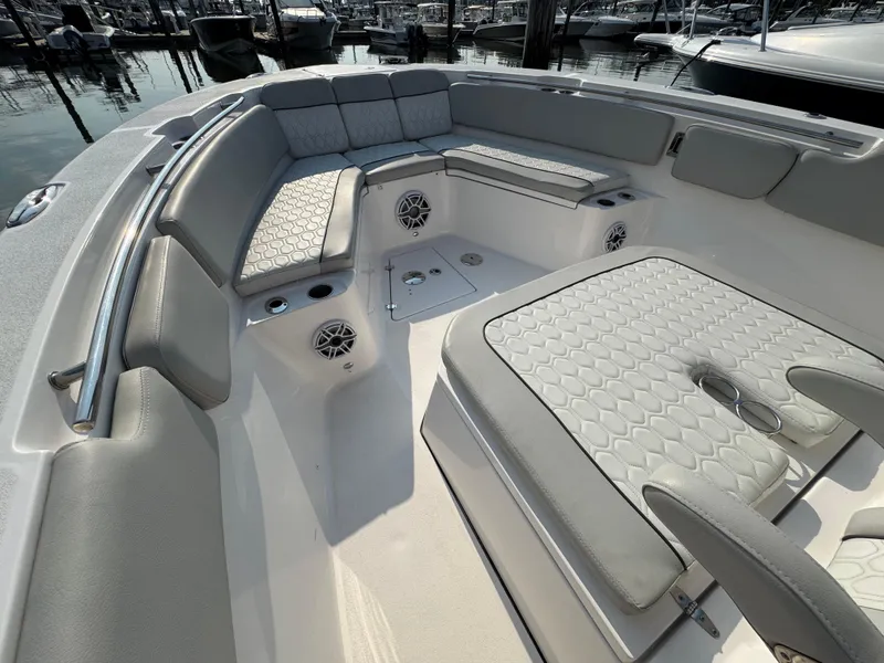 Slide: The Image of 2022 Sea Fox 328 Commander boat interior with cushioned seating and speakers. - 31