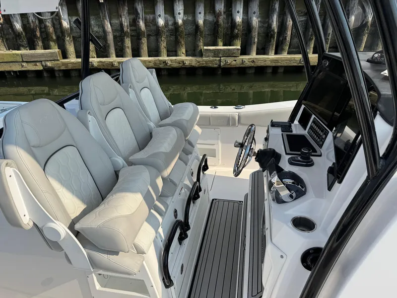 Slide: The Image of Interior of 2022 Sea Fox 328 Commander boat with plush seating and modern controls. - 32