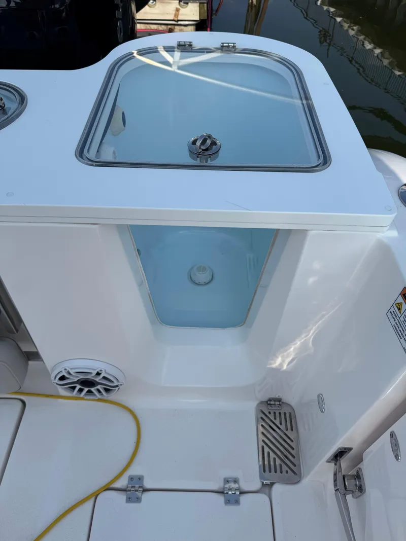 Slide: The Image of 2022 Sea Fox 328 Commander livewell with clear lid and speaker on deck. - 38