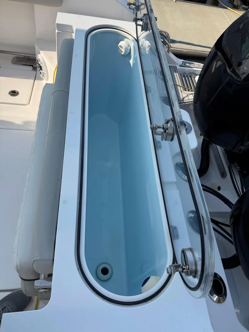 Slide: The Image of 2022 Sea Fox 328 Commander livewell with glass lid and seating. - 39