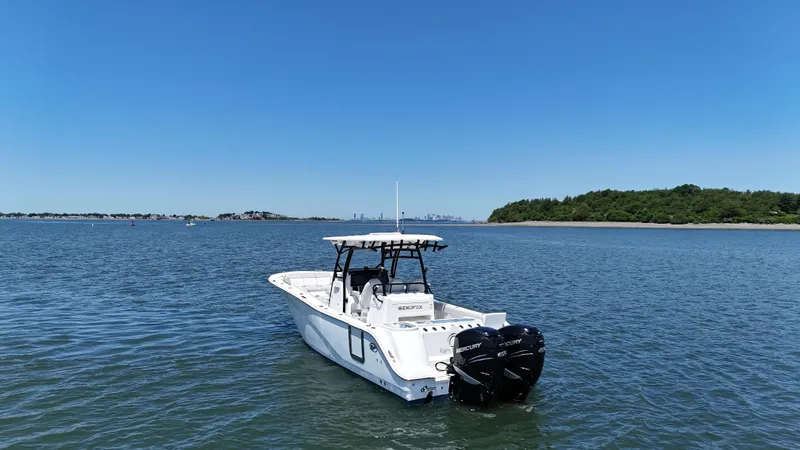 Slide: The Image of 2022 Sea Fox 328 Commander boat on calm water with clear blue sky. - 6