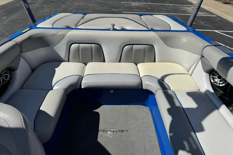 Slide: The Image of 2011 Centurion Avalanche C4 boat interior with gray and blue seating. - 10
