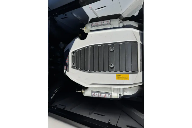 Slide: The Image of 2011 Centurion Avalanche C4 engine compartment with visible components and branding. - 11