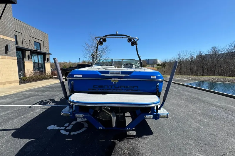Slide: The Image of 2011 Centurion Avalanche C4 boat parked outdoors on a sunny day. - 4