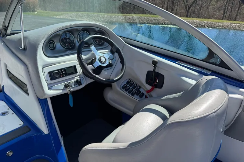 Slide: The Image of Interior of 2011 Centurion Avalanche C4 boat with steering wheel and dashboard controls. - 8