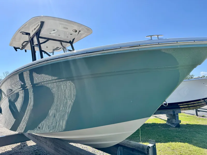 Slide: The Image of 2021 Sea Fox 228 Commander boat on a trailer under sunny skies. - 21