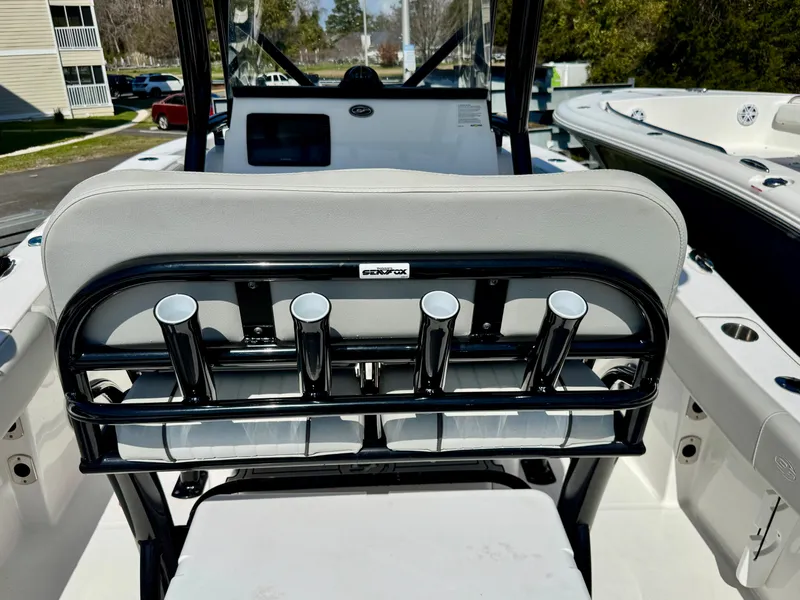 Slide: The Image of Rear view of a 2021 Sea Fox 228 Commander boat with fishing rod holders. - 15