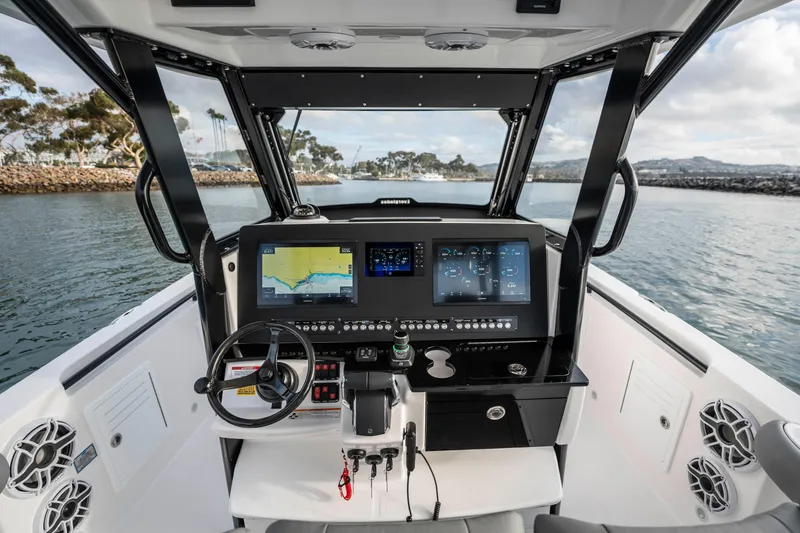 Slide: The Image of 2024 Everglades 365 Center Console boat dashboard with advanced navigation system. - 102