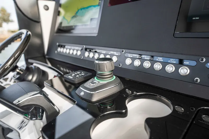 Slide: The Image of Control panel of 2024 Everglades 365 Center Console boat with joystick and buttons. - 103