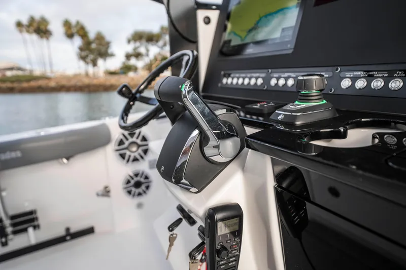 Slide: The Image of 2024 Everglades 365 Center Console boat dashboard with controls and navigation system. - 104