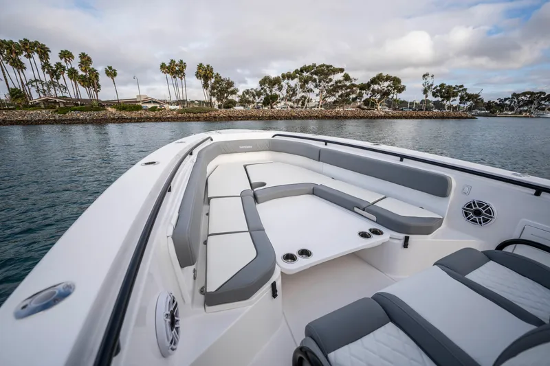 Slide: The Image of 2024 Everglades 365 Center Console boat with spacious seating, on calm water. - 107