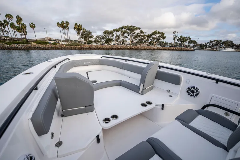 Slide: The Image of 2024 Everglades 365 Center Console boat interior with seating and ocean view. - 108